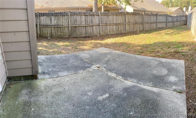 5566 Robmont Dr, Fayetteville, NC 28306 - fenced backyard featuring a patio area