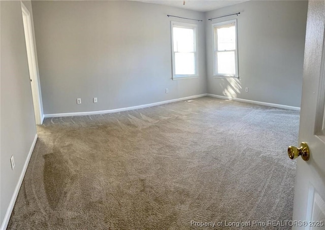 5566 Robmont Dr, Fayetteville, NC 28306 - carpeted spare room with baseboards