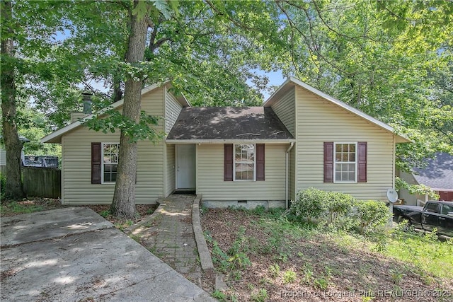 303 Whipple Tree Ln, Fayetteville, NC 28314 - mid-century inspired home with roof with shingles, crawl space, and a chimney