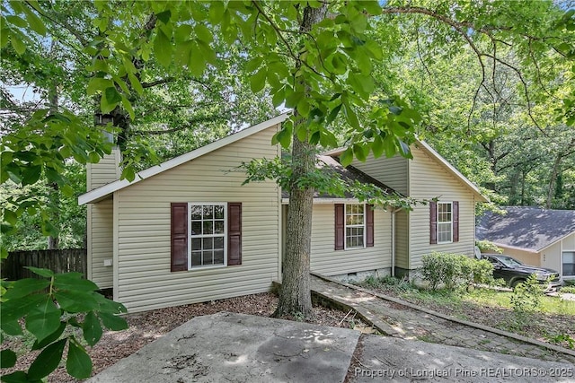 303 Whipple Tree Ln, Fayetteville, NC 28314 - view of front facade with a patio, a chimney, and crawl space