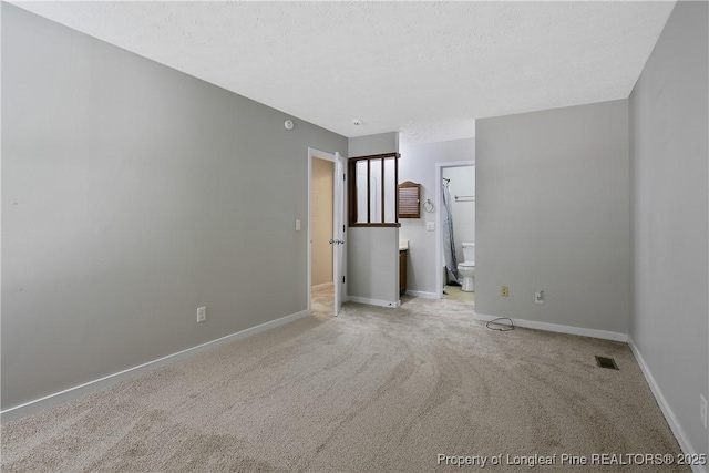 303 Whipple Tree Ln, Fayetteville, NC 28314 - empty room with light carpet and a textured ceiling