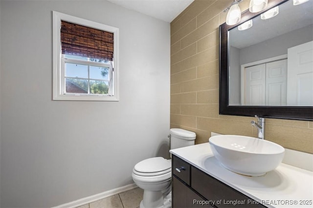 7616 Spurge Dr, Fayetteville, NC 28311 - bathroom featuring tile walls, vanity, and tile patterned flooring