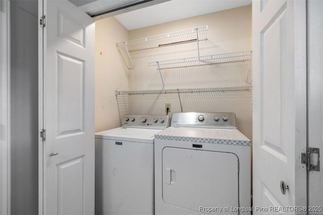 7616 Spurge Dr, Fayetteville, NC 28311 - laundry area with washer and clothes dryer