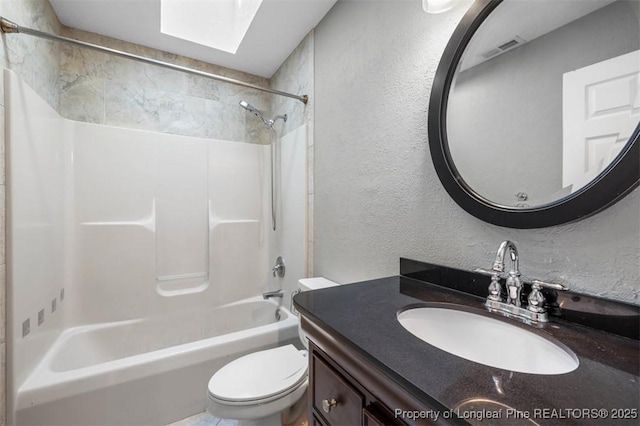 7616 Spurge Dr, Fayetteville, NC 28311 - bathroom with a skylight, tub / shower combination, a textured wall, and vanity