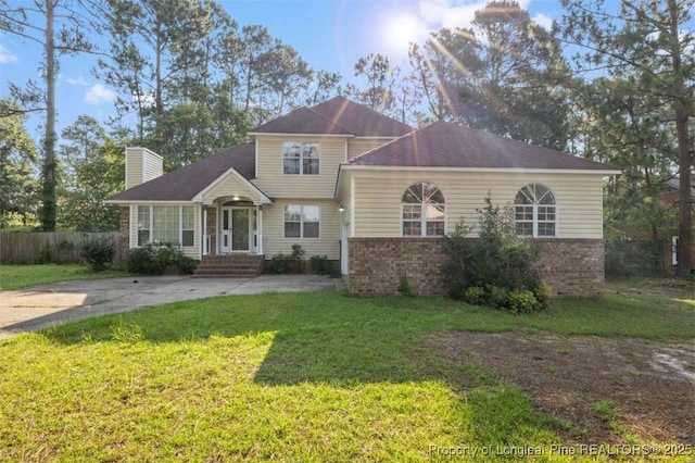 7616 Spurge Dr, Fayetteville, NC 28311 - traditional home featuring a chimney and brick siding