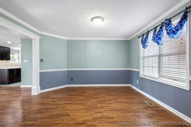 7616 Spurge Dr, Fayetteville, NC 28311 - spare room with a textured ceiling, wood finished floors, and crown molding