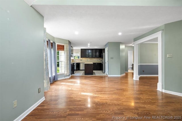7616 Spurge Dr, Fayetteville, NC 28311 - unfurnished living room with light wood-type flooring and recessed lighting