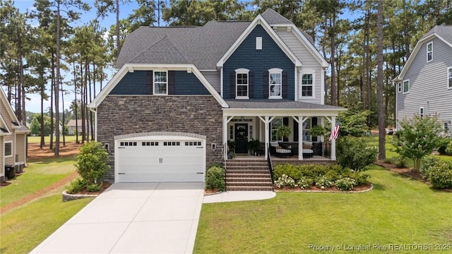 500 Legacy Lakes Way, Aberdeen, NC 28315 - view of front of property featuring covered porch, stone siding, a front lawn, and driveway