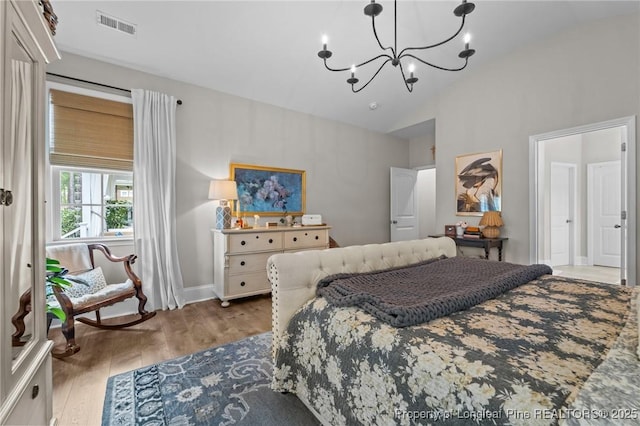 500 Legacy Lakes Way, Aberdeen, NC 28315 - bedroom with a chandelier, wood finished floors, and high vaulted ceiling