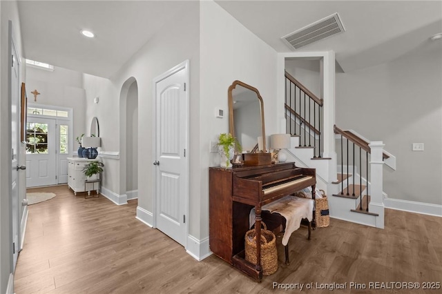 500 Legacy Lakes Way, Aberdeen, NC 28315 - hall with wood finished floors, stairs, arched walkways, and recessed lighting