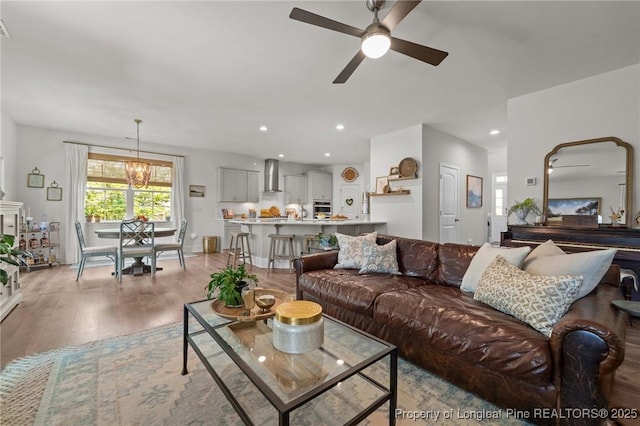 500 Legacy Lakes Way, Aberdeen, NC 28315 - living room with light wood-style floors, a ceiling fan, recessed lighting, and a chandelier