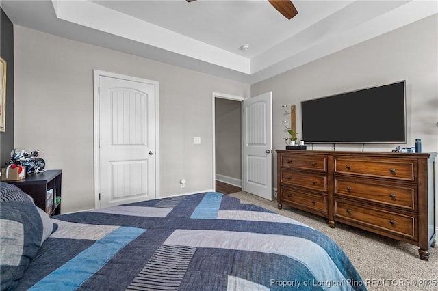500 Legacy Lakes Way, Aberdeen, NC 28315 - carpeted bedroom featuring a tray ceiling and ceiling fan