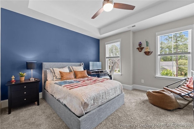500 Legacy Lakes Way, Aberdeen, NC 28315 - carpeted bedroom featuring a raised ceiling and ceiling fan