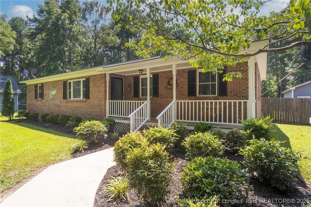 single story home with brick siding and covered porch