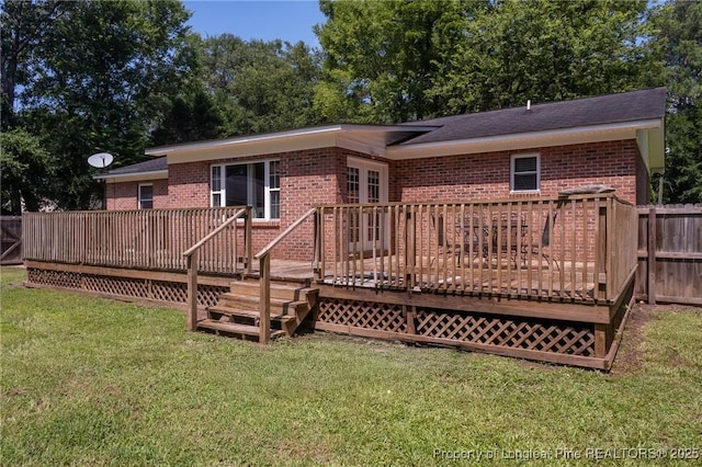rear view of house with brick siding and a wooden deck