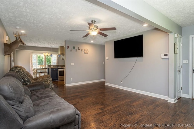 living room featuring a textured ceiling, wood finished floors, ceiling fan, and recessed lighting