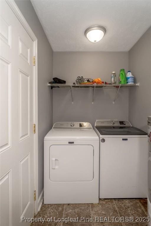 laundry area featuring independent washer and dryer