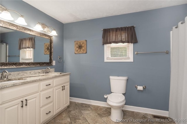 bathroom featuring double vanity and a shower with curtain