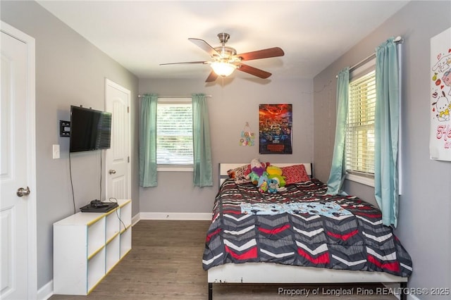 bedroom with wood finished floors and a ceiling fan