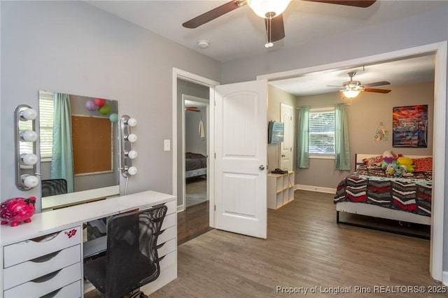office featuring a ceiling fan and wood finished floors