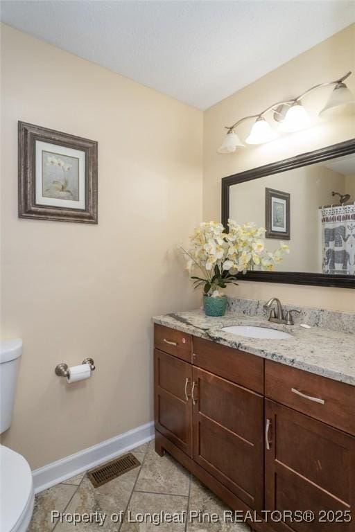 full bath with vanity and tile patterned floors
