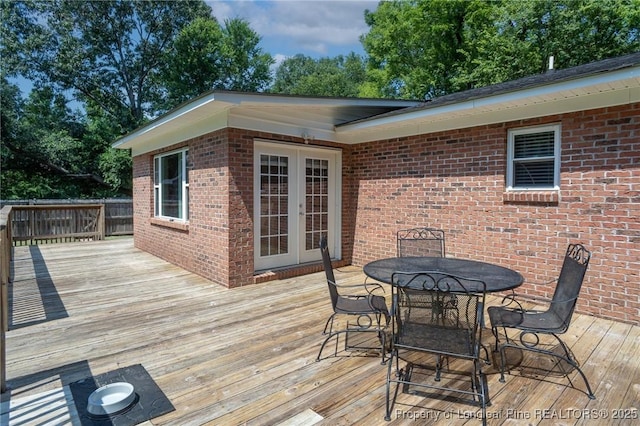 wooden deck featuring outdoor dining space