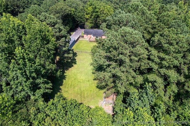 view from above of property featuring a forest