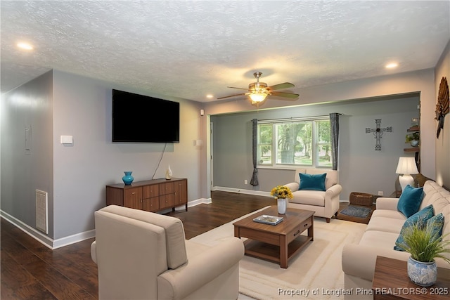 living area featuring wood finished floors, recessed lighting, ceiling fan, and a textured ceiling