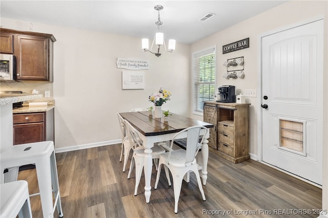1206 Coot Ct, Hope Mills, NC 28348 - dining room featuring dark wood-style flooring and a chandelier