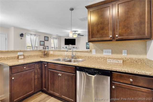 1206 Coot Ct, Hope Mills, NC 28348 - kitchen with dishwasher, a ceiling fan, light stone countertops, light wood finished floors, and tasteful backsplash