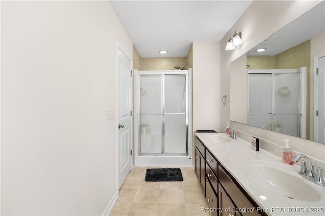 1206 Coot Ct, Hope Mills, NC 28348 - bathroom with a shower stall, double vanity, and tile patterned floors