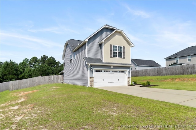 1206 Coot Ct, Hope Mills, NC 28348 - view of front of home with stone siding, an attached garage, and concrete driveway
