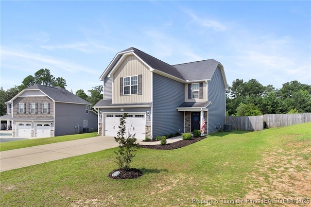 1206 Coot Ct, Hope Mills, NC 28348 - view of front of house featuring a garage, stone siding, driveway, and board and batten siding