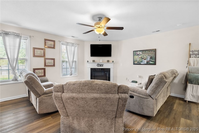1206 Coot Ct, Hope Mills, NC 28348 - living area with ceiling fan, a glass covered fireplace, and dark wood-style floors