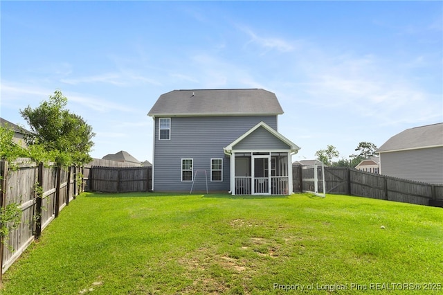 1206 Coot Ct, Hope Mills, NC 28348 - rear view of property featuring a sunroom and a fenced backyard