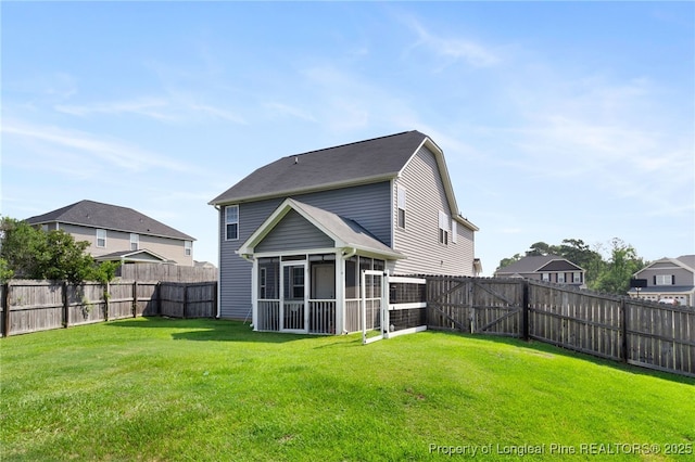 1206 Coot Ct, Hope Mills, NC 28348 - rear view of property with a sunroom and a fenced backyard