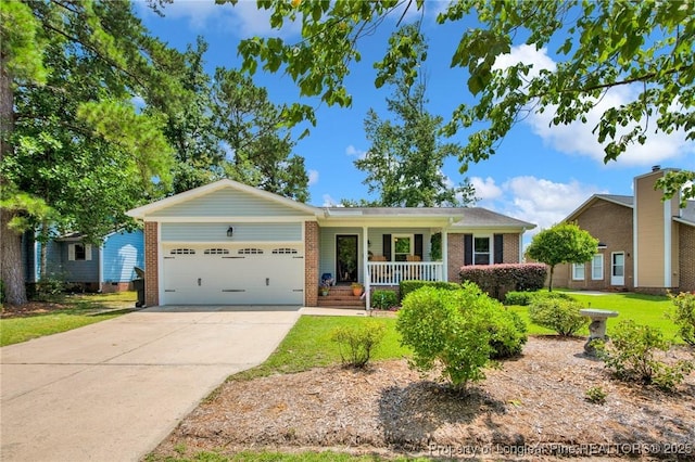 4327 Falls Dr, Hope Mills, NC 28348 - single story home featuring brick siding, covered porch, driveway, and a garage