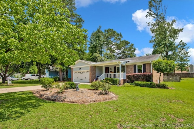 4327 Falls Dr, Hope Mills, NC 28348 - single story home with a garage, covered porch, driveway, and brick siding