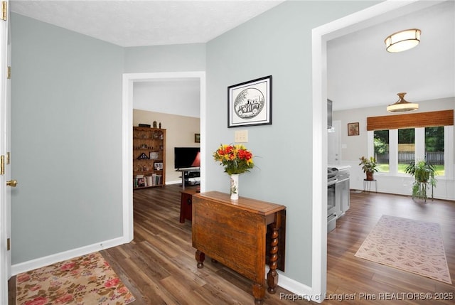 4327 Falls Dr, Hope Mills, NC 28348 - hall with wood finished floors and baseboards