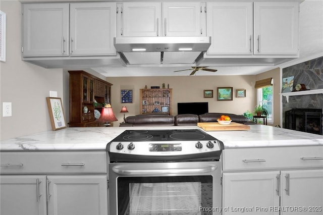 4327 Falls Dr, Hope Mills, NC 28348 - kitchen with electric range, under cabinet range hood, ceiling fan, open floor plan, and white cabinetry