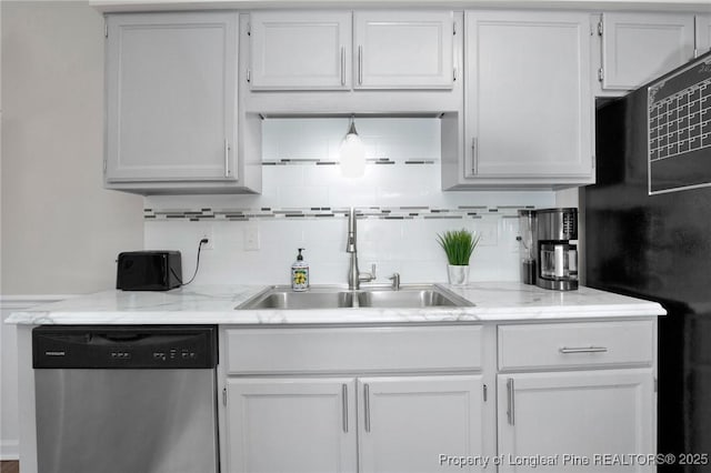 4327 Falls Dr, Hope Mills, NC 28348 - kitchen with stainless steel dishwasher, freestanding refrigerator, tasteful backsplash, and white cabinetry