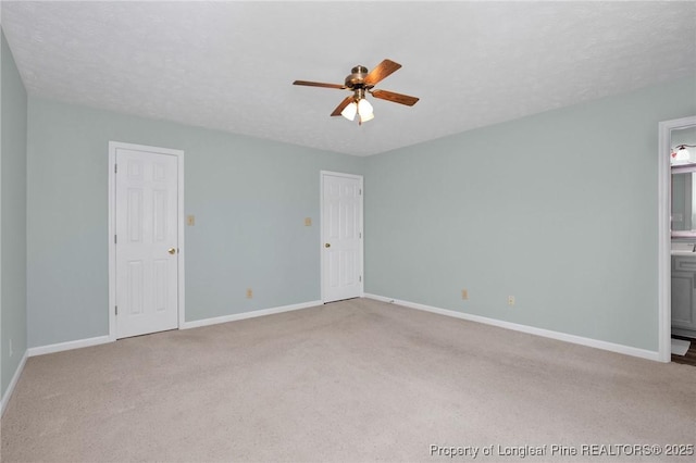 4327 Falls Dr, Hope Mills, NC 28348 - unfurnished bedroom with carpet floors, ensuite bathroom, and ceiling fan
