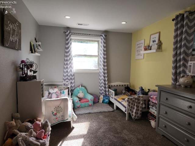 bedroom featuring dark colored carpet