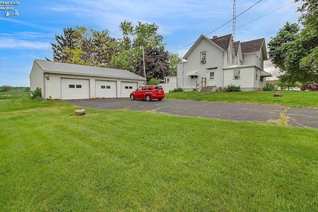 exterior space featuring an outbuilding and a garage