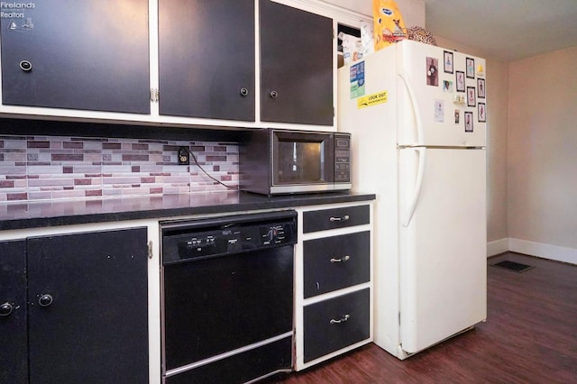 kitchen featuring tasteful backsplash, black appliances, and dark hardwood / wood-style flooring