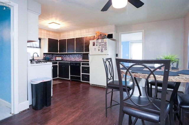 kitchen with dark hardwood / wood-style floors, ceiling fan, black appliances, tasteful backsplash, and dark brown cabinetry