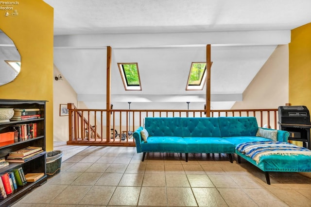 living area featuring tile flooring, a textured ceiling, and a skylight