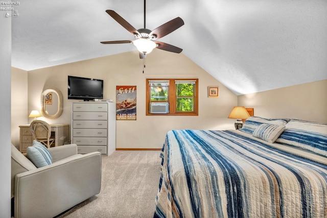 bedroom with light colored carpet, vaulted ceiling, ceiling fan, and a textured ceiling