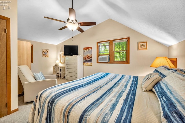 bedroom with a textured ceiling, carpet floors, ceiling fan, and vaulted ceiling