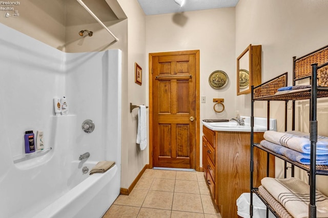 bathroom with tile floors,  shower combination, and vanity